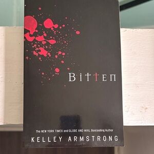 Bitten by Kelley Armstrong - Paperback Novel in Black & Red
